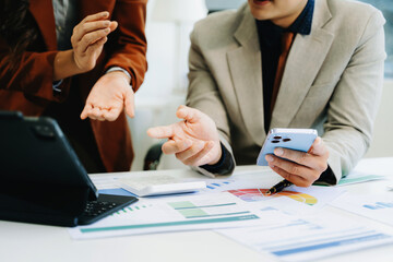 Team business meeting presentation. Hand businessman working project in modern office.Laptop computer and tablet and smart phone