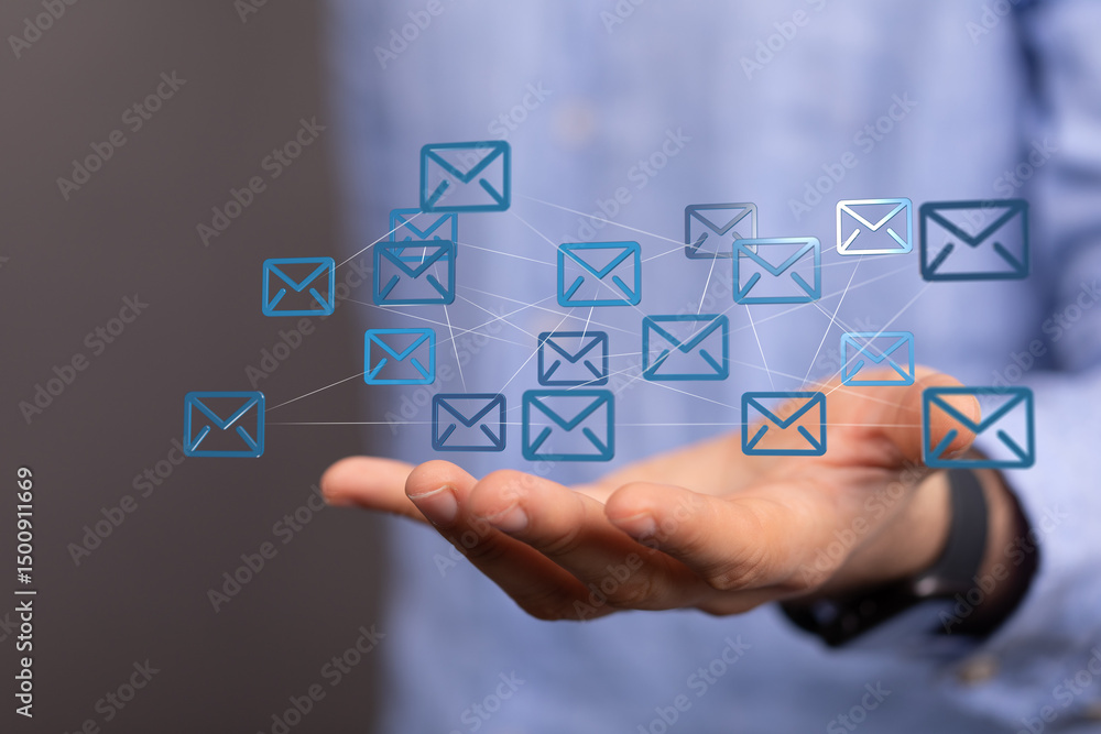 Poster hand holding digital email icons, representing global communication and networking.