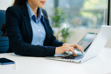 Businesswoman hand working digital marketing media in virtual screen with mobile phone and modern...