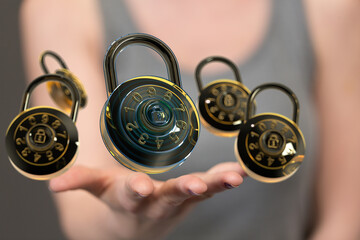 Image of multiple combination locks hovering above a hand, symbolizing digital security and data...