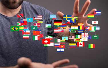 Image of a man connecting with various countries' flags, symbolizing global networking and...