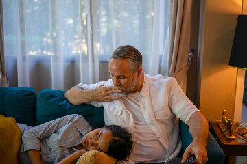 Couple are resting in living room.