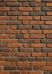 Obraz premium Realistic Photo Of A Brick Wall With Red And Brown Bricks Texture Background
