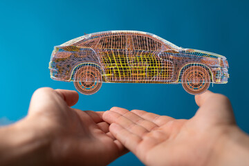 Innovative automotive design concept.  Wireframe car model in hands, symbolizing new technology.