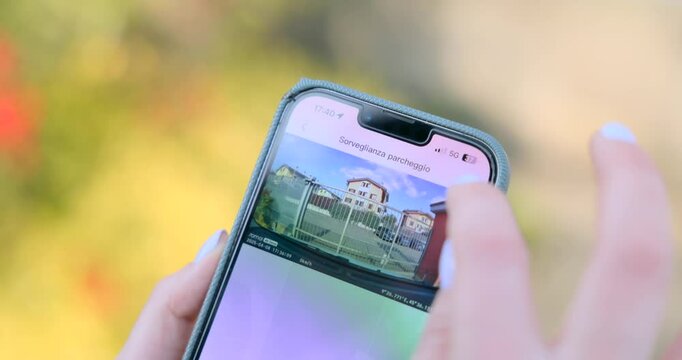 Person Downloading And Exporting Video Footage Into Her Mobile Phone. - closeup shot