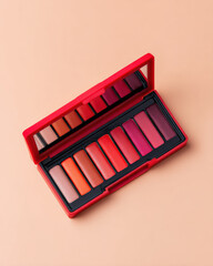 Vivid lipstick palette with multiple shades arranged neatly in red case, showcasing variety of colors perfect for makeup enthusiasts. vibrant hues evoke creativity and style