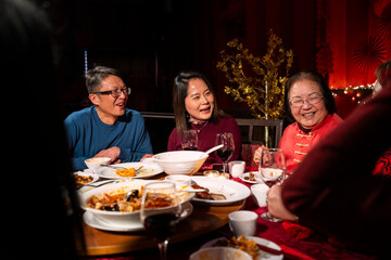 Family enjoying Chinese New Year dinner in restaurant