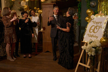 People at 60th birthday party at nightclub