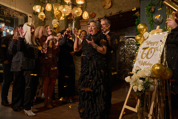 People at 60th birthday party at nightclub