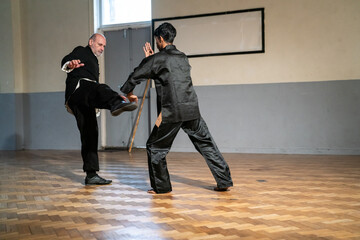 Man undergoing Kung Fu Black Belt test