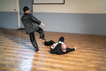 Man undergoing Kung Fu Black Belt test