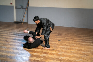Man performing during Kung Fu Black Belt test