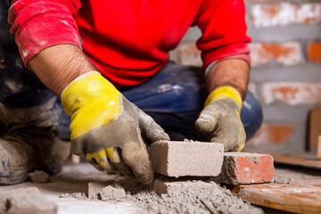 Crafting a wall with aerated blocks in a construction site