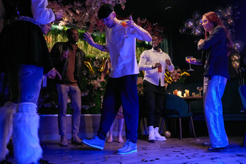 Group of friends celebrating New Year in nightclub