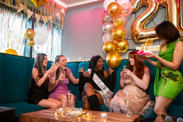 Group of female friends celebrating 21st birthday