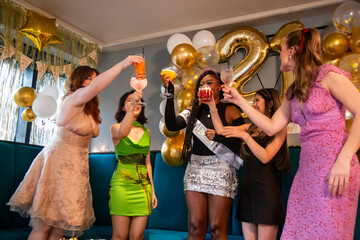 Group of female friends celebrating 21st birthday