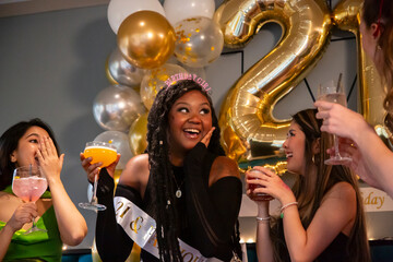 Group of female friends celebrating 21st birthday