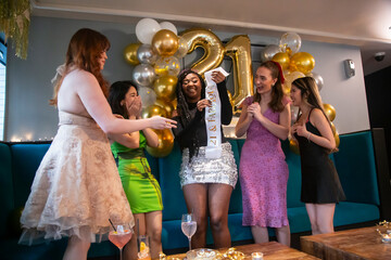 Group of female friends celebrating 21st birthday