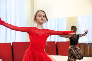 girl dancing a standard program in ballroom dancing