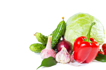Mix of colorful vegetables - bell pepper, cabbage, tomatoes, cucumbers, onions and garlic.