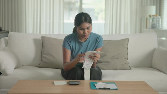 Cost of living income expense saving budget in black asia people Gen Z young adult woman. Looking credit card bill debt home loan money paying happy asian female healthy wealth care goal plan tracking