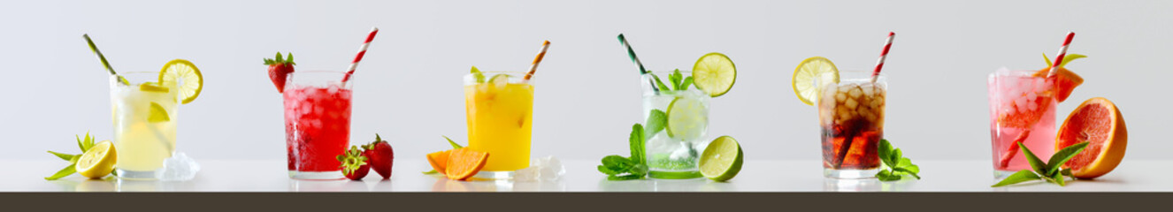 Collection of refreshing drinks with ice light isolated background