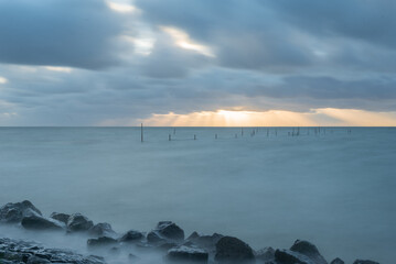 Fishing nets at the IJsselmeer at sunset