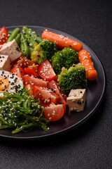 Vegan salad, bowls with chickpeas, broccoli, tomatoes, tofu cheese and boiled eggs