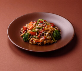 Chinese or Thai food, rice noodles with meat, salt and spices. Asian food