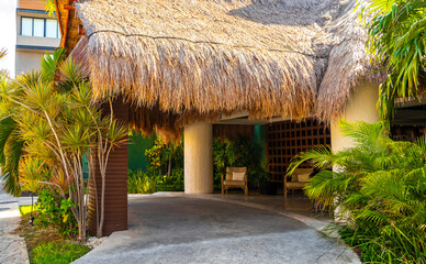 Modern buildings architecture hotels apartments palm Playa del Carmen Mexico.