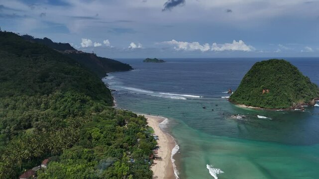 Aerial drone view of red island east java indonesia tropical beach surfers ocean waves
