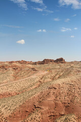SUV car moving on dusty road at Pingshan Hu Grand Canyon in summer, Zhangye City, Gansu Province in China