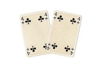Obraz premium A pair of identical vintage playing cards isolated on a white background.