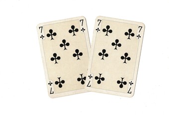 A pair of identical vintage playing cards isolated on a white background.