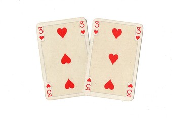 A pair of identical vintage playing cards isolated on a white background.