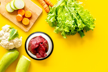 Cooking natural pet food with meat and vegetables, top view
