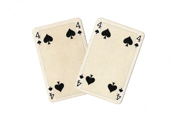 A pair of identical vintage playing cards isolated on a white background.