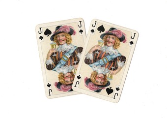 A pair of identical vintage playing cards isolated on a white background.