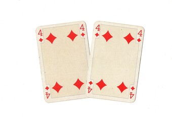 A pair of identical vintage playing cards isolated on a white background.