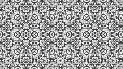 Seamless pattern of black and white circles and diamonds in a repeating design element