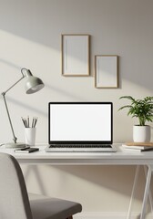 Minimalist Workspace Photo Featuring a Laptop Two Picture Frames and Plant