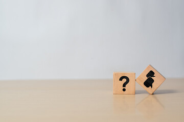 Q and A symbols on wooden cube blocks on gray background. Concept of FAQ, question and answer,...