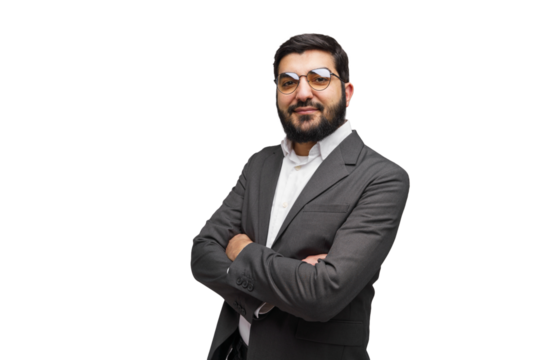 Confident businessman in stylish attire stands with arms crossed against a clean white backdrop
