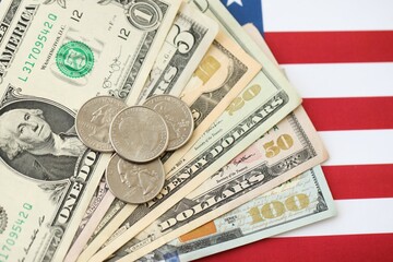 American US dollars money bills and on American flag close up