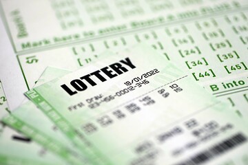 Green lottery tickets and blank bills with numbers for playing lottery