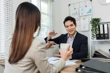 Professional Financial Consultation. Colleagues discussing business strategies and sharing insights in a modern office.
