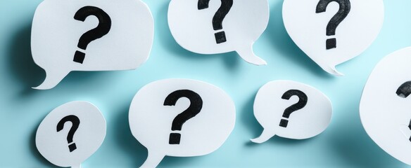 The collection of question marks in speech bubbles on a blue background.