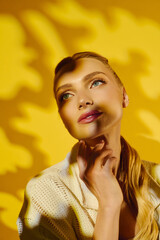 Captivating portrait of a young woman embracing sunlight and shadows in a vibrant setting © Bliss