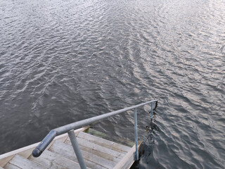 A staircase leads down to the water