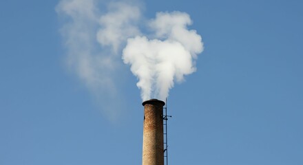 Chimney with White Smoke Against Blue Sky